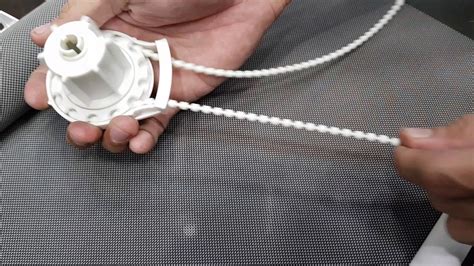When you screw the nut hold the opposite edge of the wheel so you wont lose any parts when you are tightening it. . How to fix a roller blind chain that has come off its track